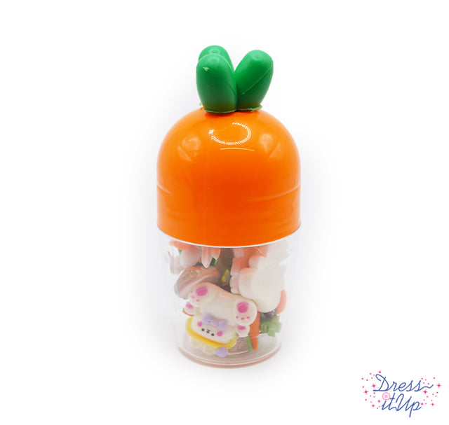 Features an assortment of beautiful hand-dyed buttons and embellishments. Bunnies, easter eggs, and carrots. Reusable plastic container