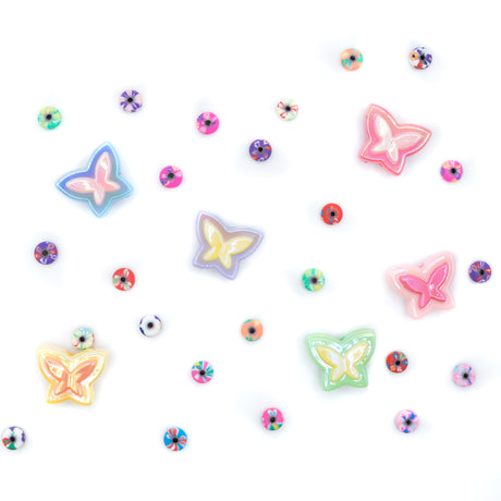 Bead assortment featuring pastel butterfly beads and small heishi beads with various floral prints.