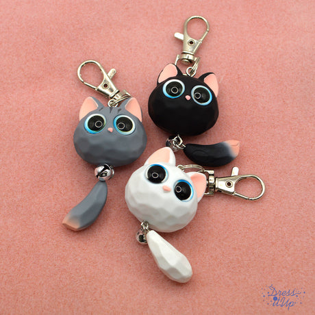 Opaque Resin Kitten Keychain features a charming big-eyed cat with a playful bell in choice of white, black or grey