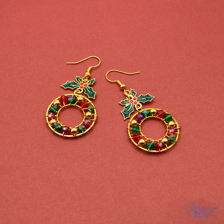  Featuring alloy enamel holly leaves and vibrant red and green accents