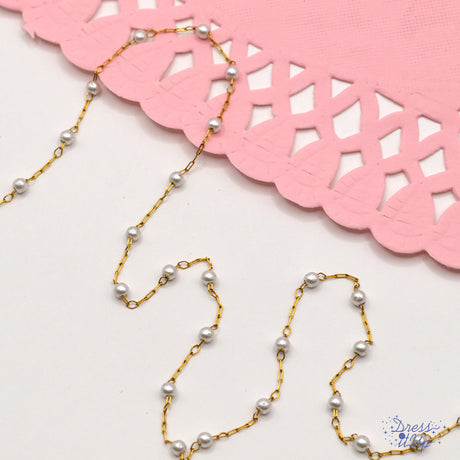 ABS plastic pearl beads with 316 stainless steel cable chain. Creamy white pearls with a golden finish