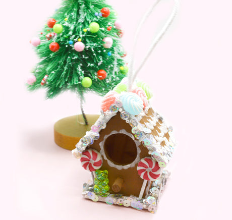 Create a gingerbread house with Build Your Own Birdhouse and candy embellishments