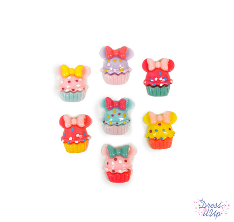Fun color cupcakes with Disney's Minnie Mouse heads, bows and sprinkles perfect for party favors 