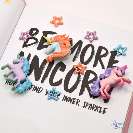 Pastel colored unicorns and beaded tiny star craft embellishments. 