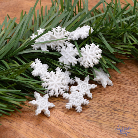 Four styles of white snowflakes add to winter sewing projects and crafts