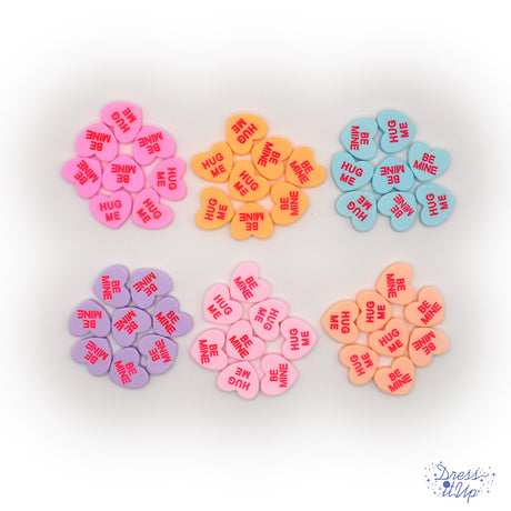 Classic candy conversation inspired heart shaped embellishments with Valentine's Day messages 'Hug Me' and 'Be Mine'