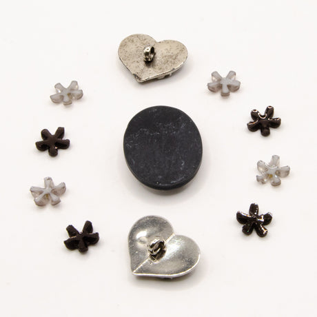 black, white, and silver metal vintage floral themed embellishment pack for crafting.