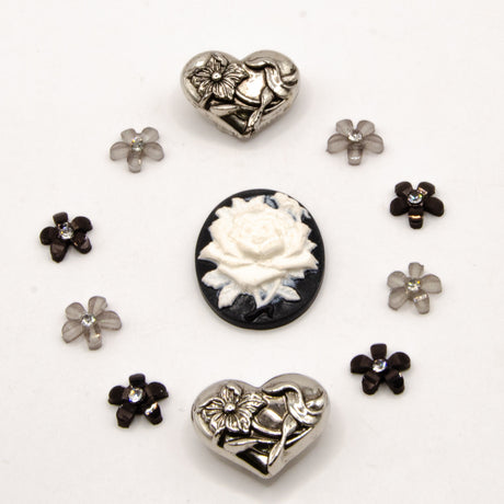 black, white, and silver metal vintage floral themed embellishment pack for crafting.