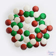 Glittery round embellishments in classic Christmas colors for crafting