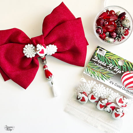 Beautiful red hair bow is dressed up with It's Cold Outside button embellishments