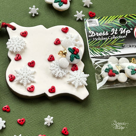 Ceramic ornament is embellished with Mickey Ornament button, snowflakes and hearts