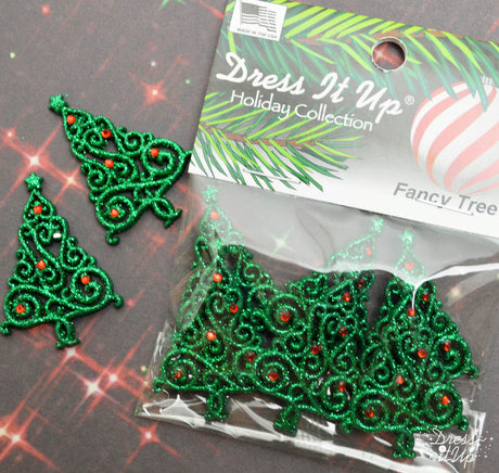 Green glittery Christmas trees are ready to embellish your holiday crafts