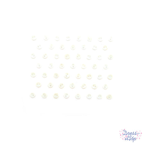 Tiny sew-thru buttons in pure white for sewing and crafting