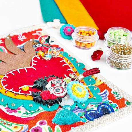 Felt heart project featuring Day of the Dead button and flower embellishments